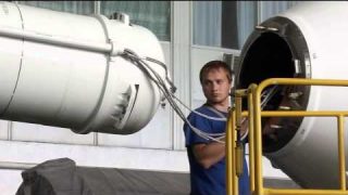 NASA Astronaut and Fellow Crew Members Prepare for Soyuz Rocket Launch