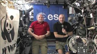 ESA astronaut André Kuipers and astronaut Don Pettit greet WWF