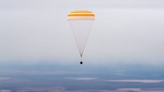 Three Space Station Crew Members Return Home Aboard Soyuz Spacecraft