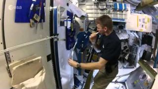 Tim Peake brushing his teeth in space